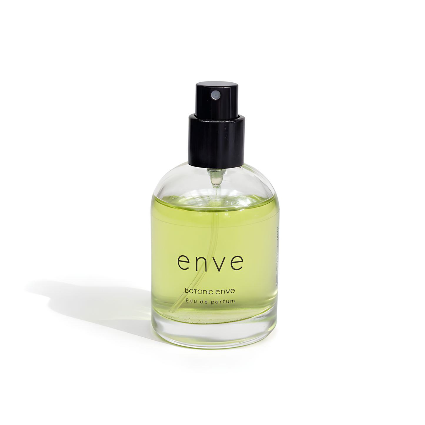 Clear bottle of 'enve' botanical perfume with a black spray nozzle on a white background