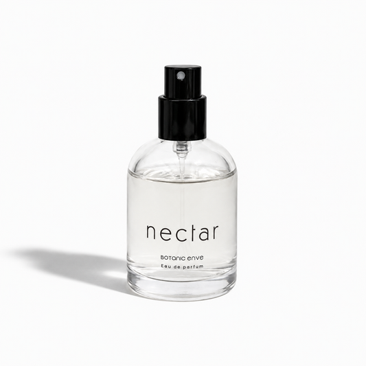 Clear spray bottle labeled 'nectar' on a white background